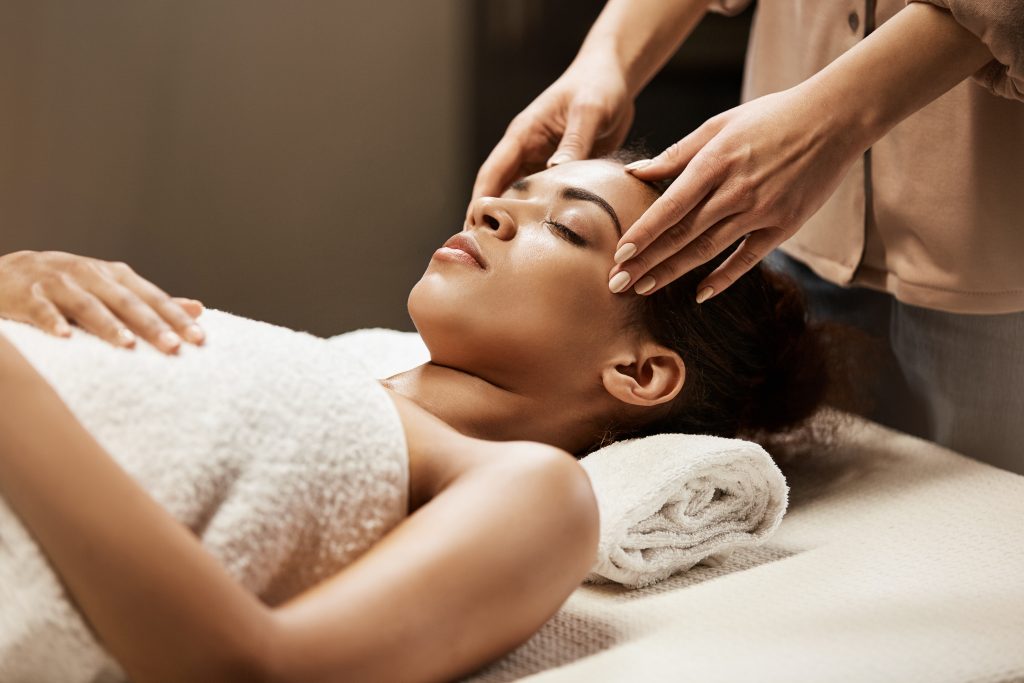 Woman undergoing holistic therapeutic massage with trinity natural health ky 